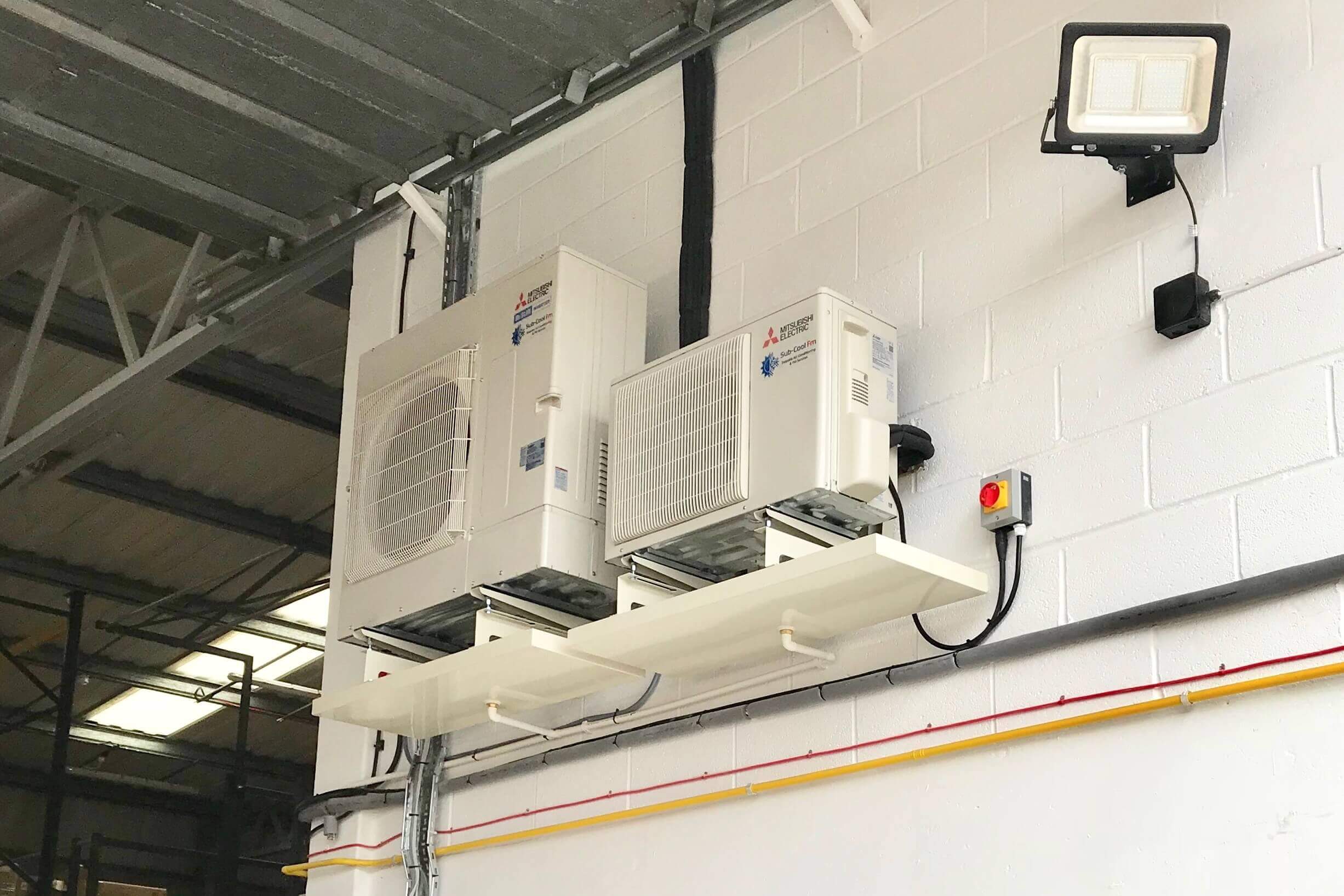 Large commercial air conditioning units installed in a warehouse