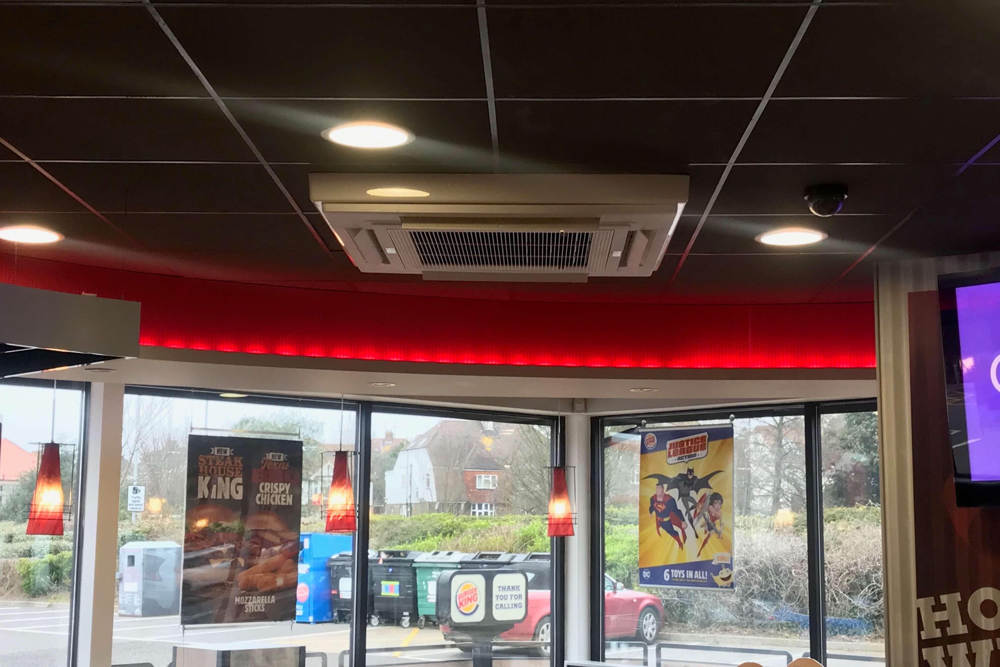 A ceiling air conditioning unit installed in a Burger King restaurant