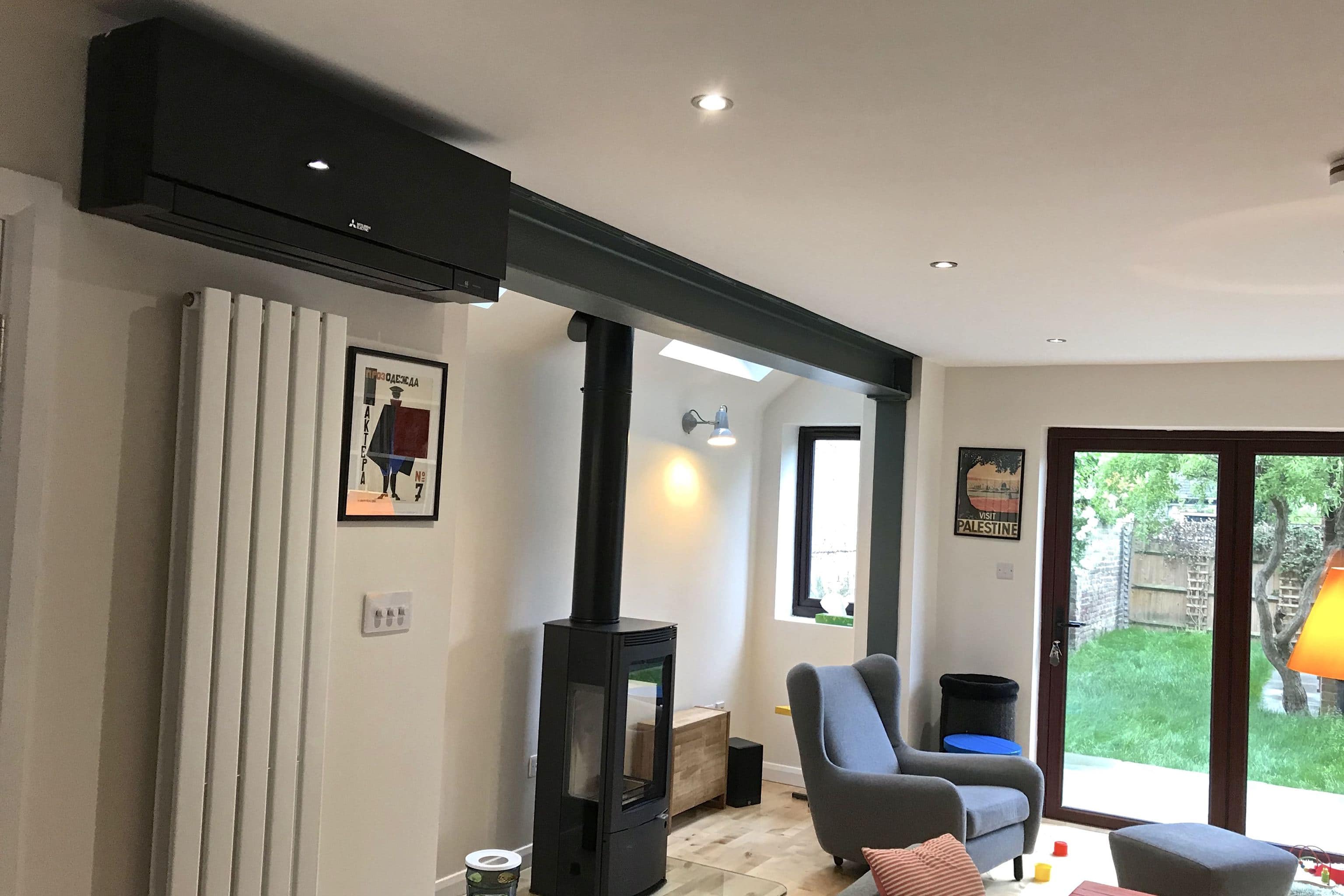 black wall mounted Mitsubishi Electric domestic air conditioning unit in living room