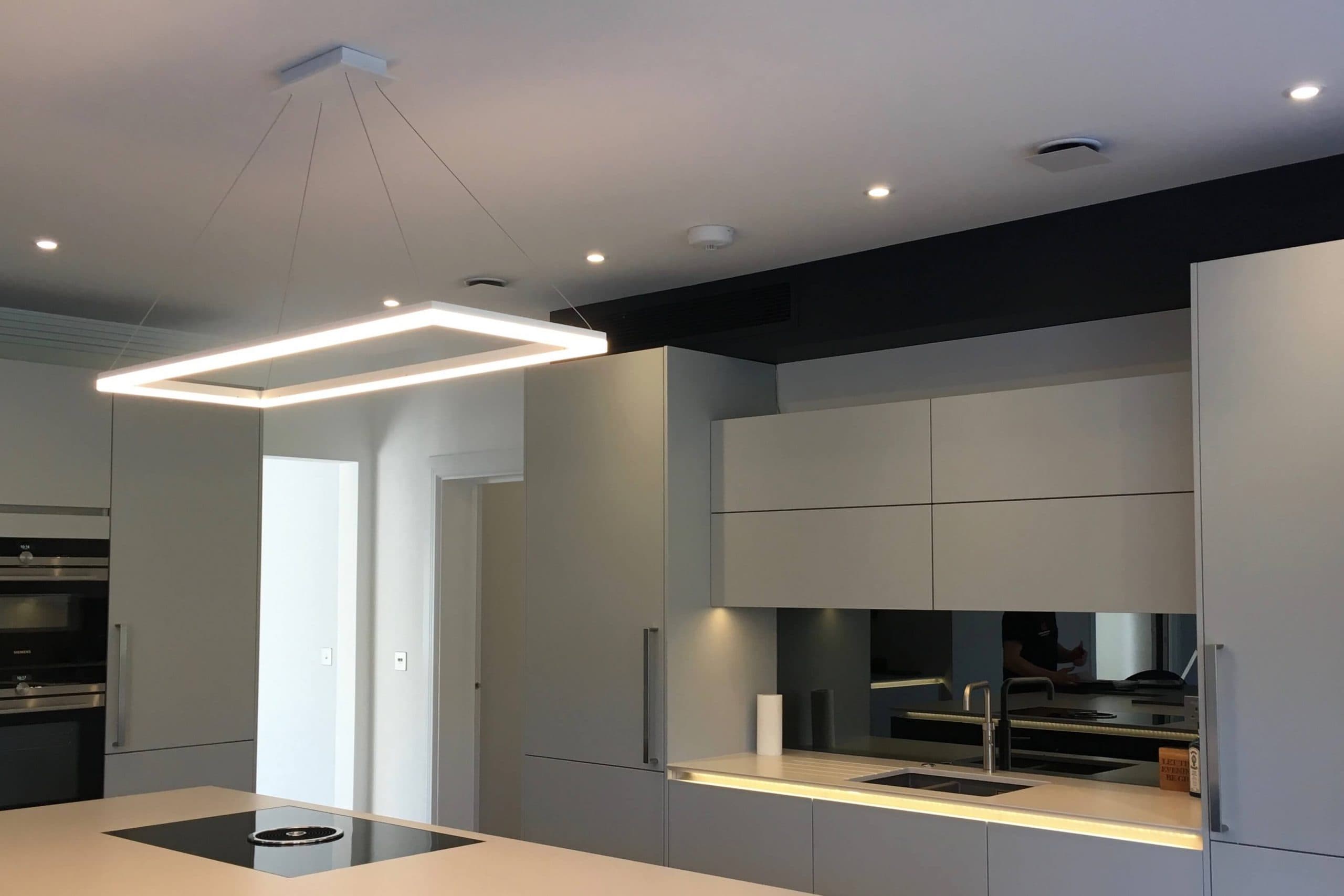 Scandia Hus new build kitchen with invisible Mitsubishi air con grill and MVHR system by SubCool FM side view