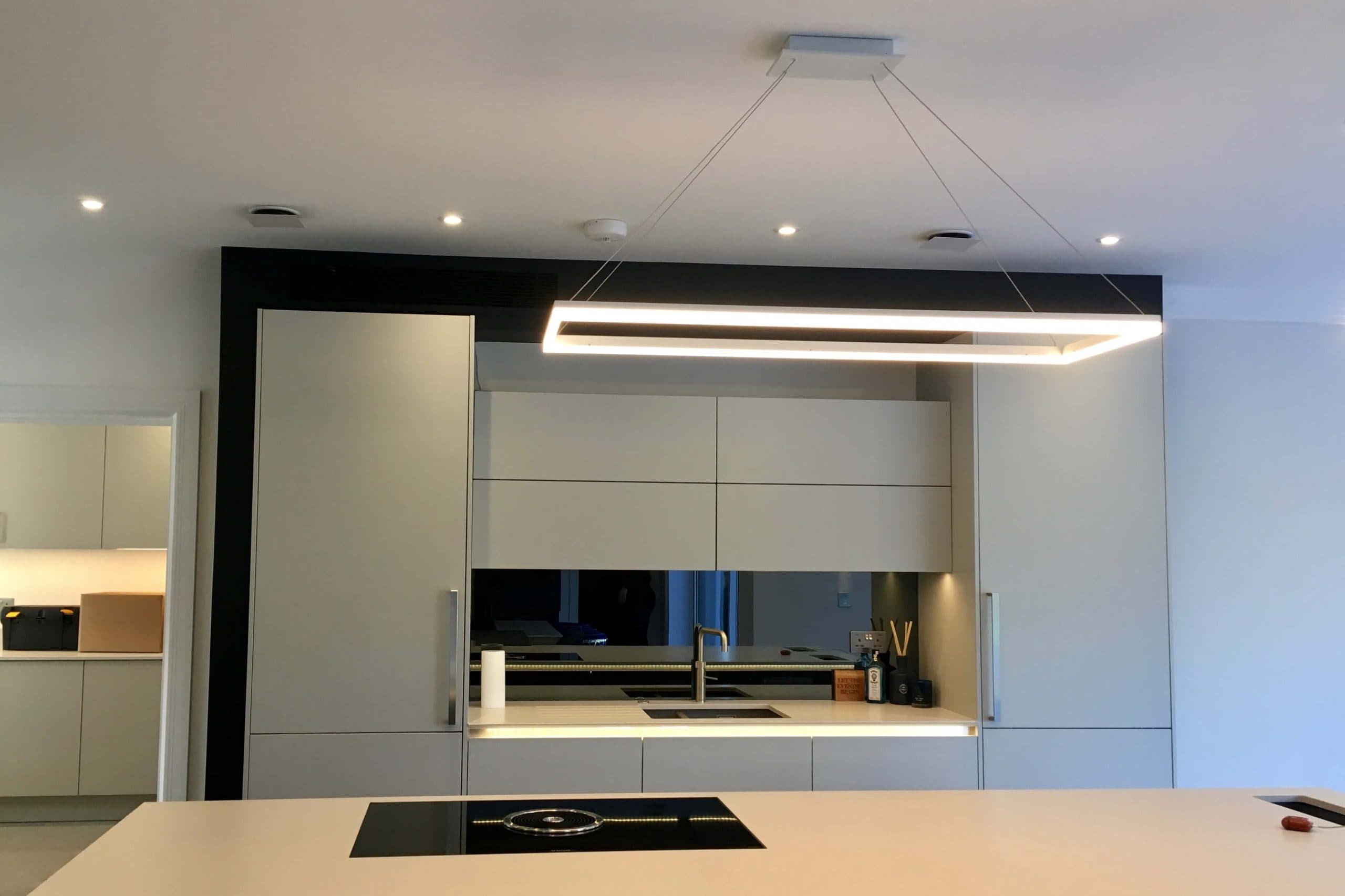 Scandia Hus new build kitchen with invisible Mitsubishi air con grill and MVHR system by SubCool FM hidden door to chill room shut