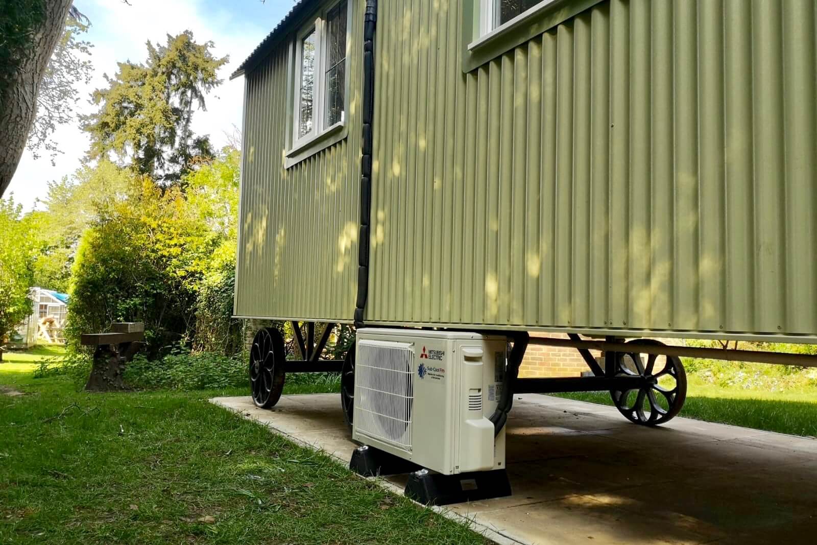 White mitsubishi air conditioning external unit shepherds hut SubCool FM