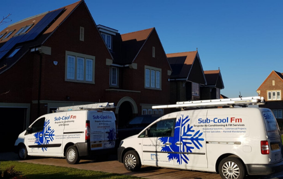 SubCoolFm air conditioning vans outside Crawley residential setting