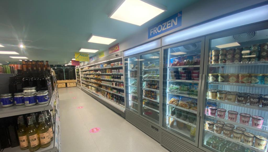 Hisbe ethical supermarket interior showing aisles and frozen goods in freezers- air conditioning solution by SubCoolFM & refrigeration by Capital Cooling