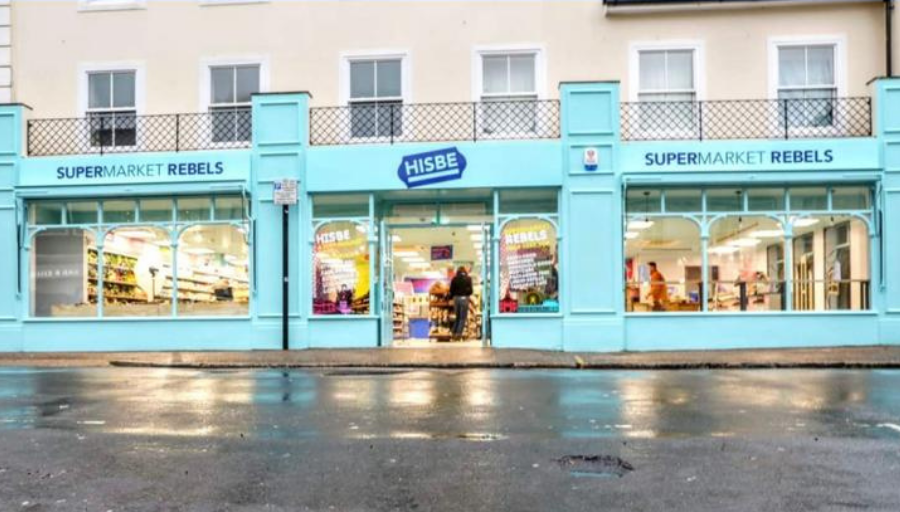 Hisbe ethical supermarket full exterior lit up on Worthing Street with Panasonic Nanoe-X air conditioning by SubCool FM