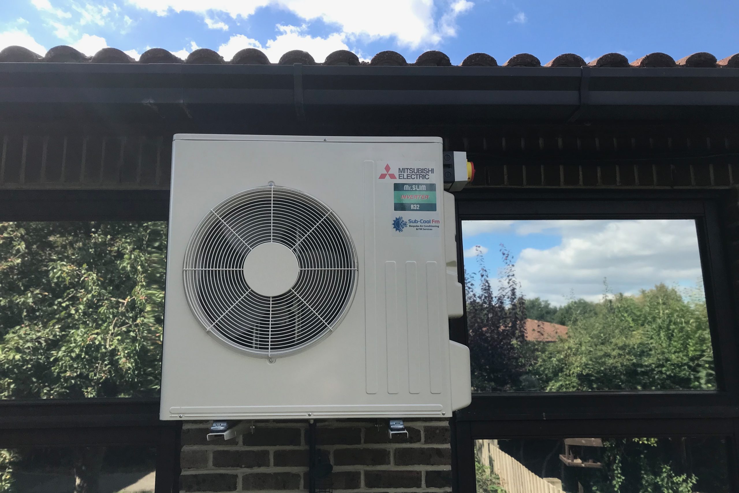 External Mitsubishi Electric air conditioning unit at primary school